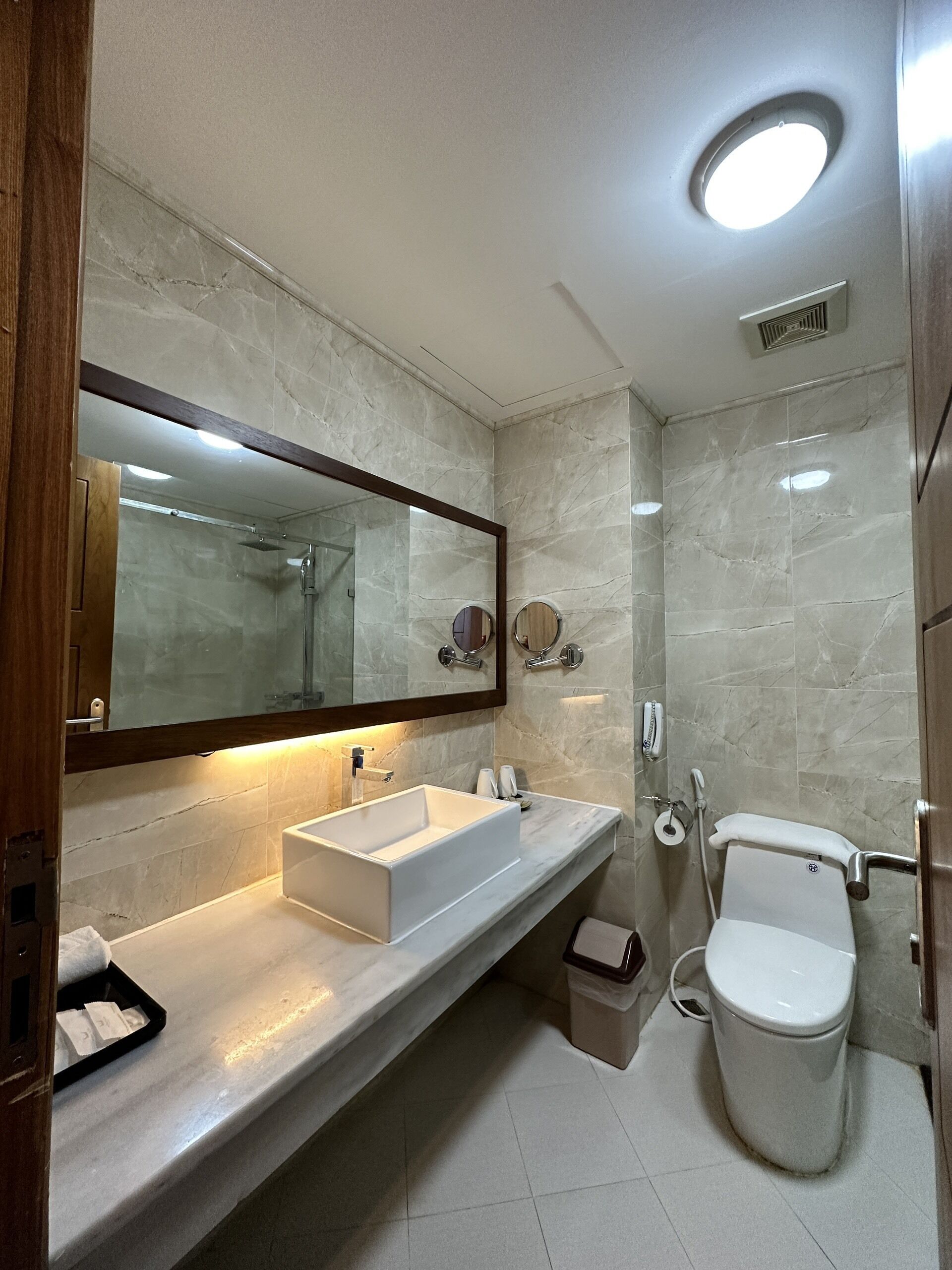 deluxe room, 1 king bed | bathroom | free toiletries, hair dryer, slippers, bidet