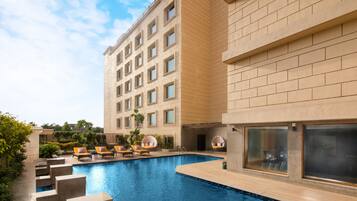Outdoor pool, open 6:00 AM to 8:00 PM, pool umbrellas, pool loungers
