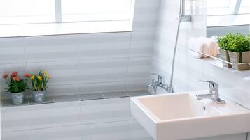 Shower, hair dryer, slippers, towels