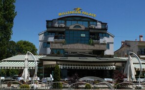 A multi-story building with a sign reading "Millennium Palace". - Millenium Palace (Ohrid)