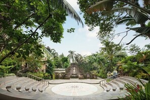 A circular outdoor staircase leading to a central structure surrounded by lush greenery. - Ayung Resort Ubud (Ubud)