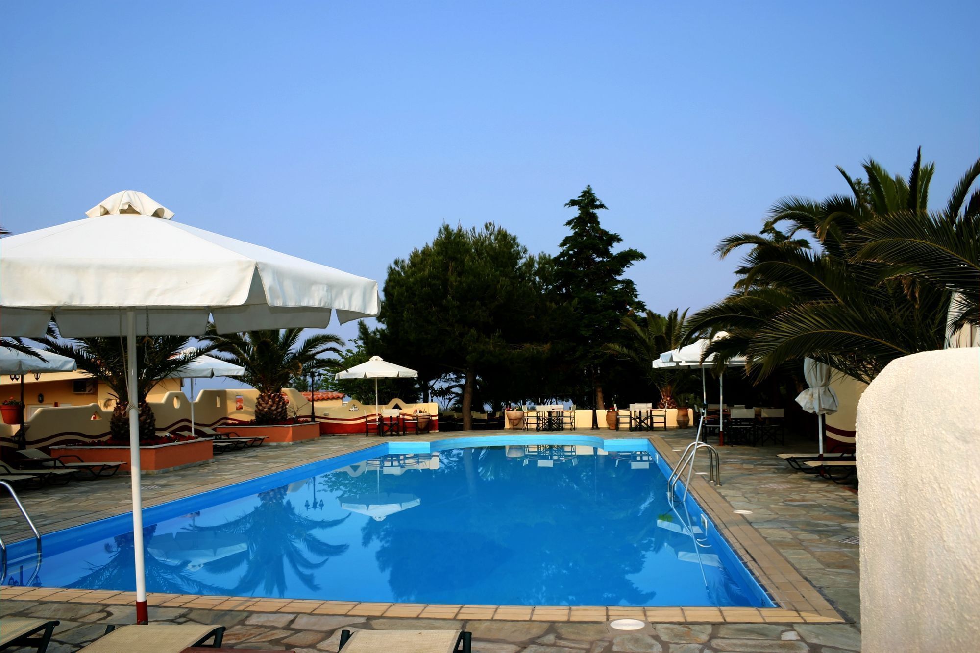 outdoor pool, pool umbrellas, pool loungers