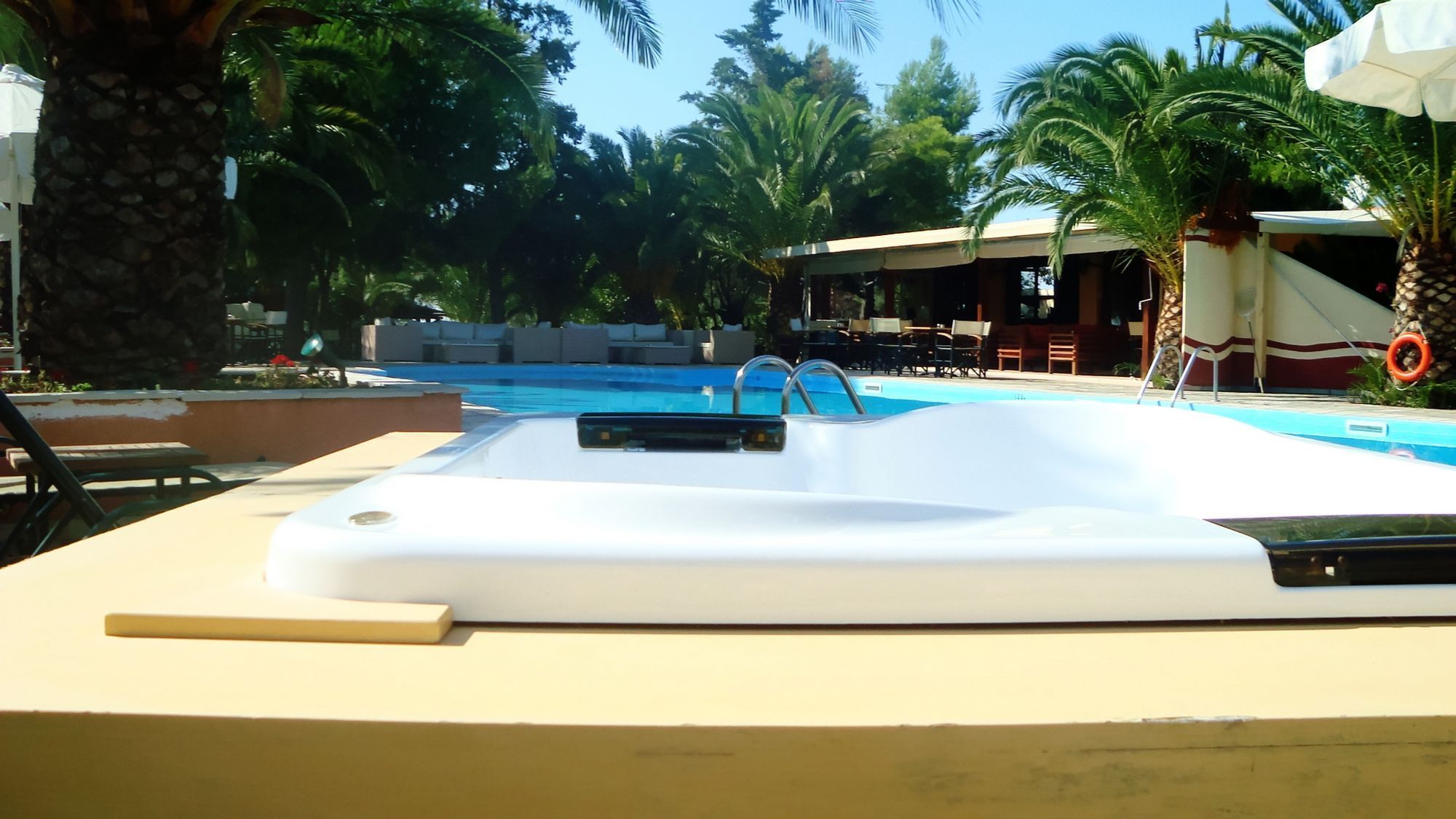 outdoor pool, pool umbrellas, pool loungers