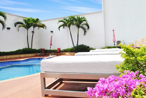 Outdoor pool, open 9:00 AM to 8:00 PM, sun loungers