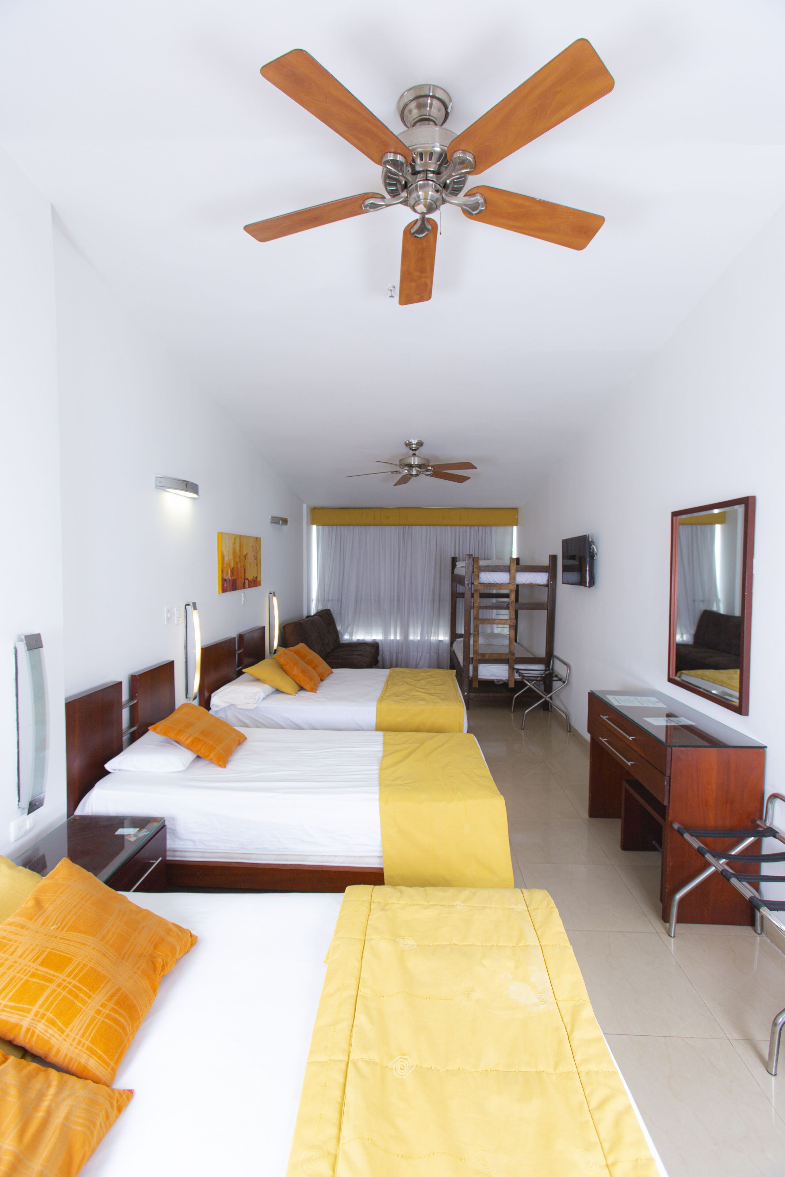 family room | minibar, in-room safe, desk, blackout curtains