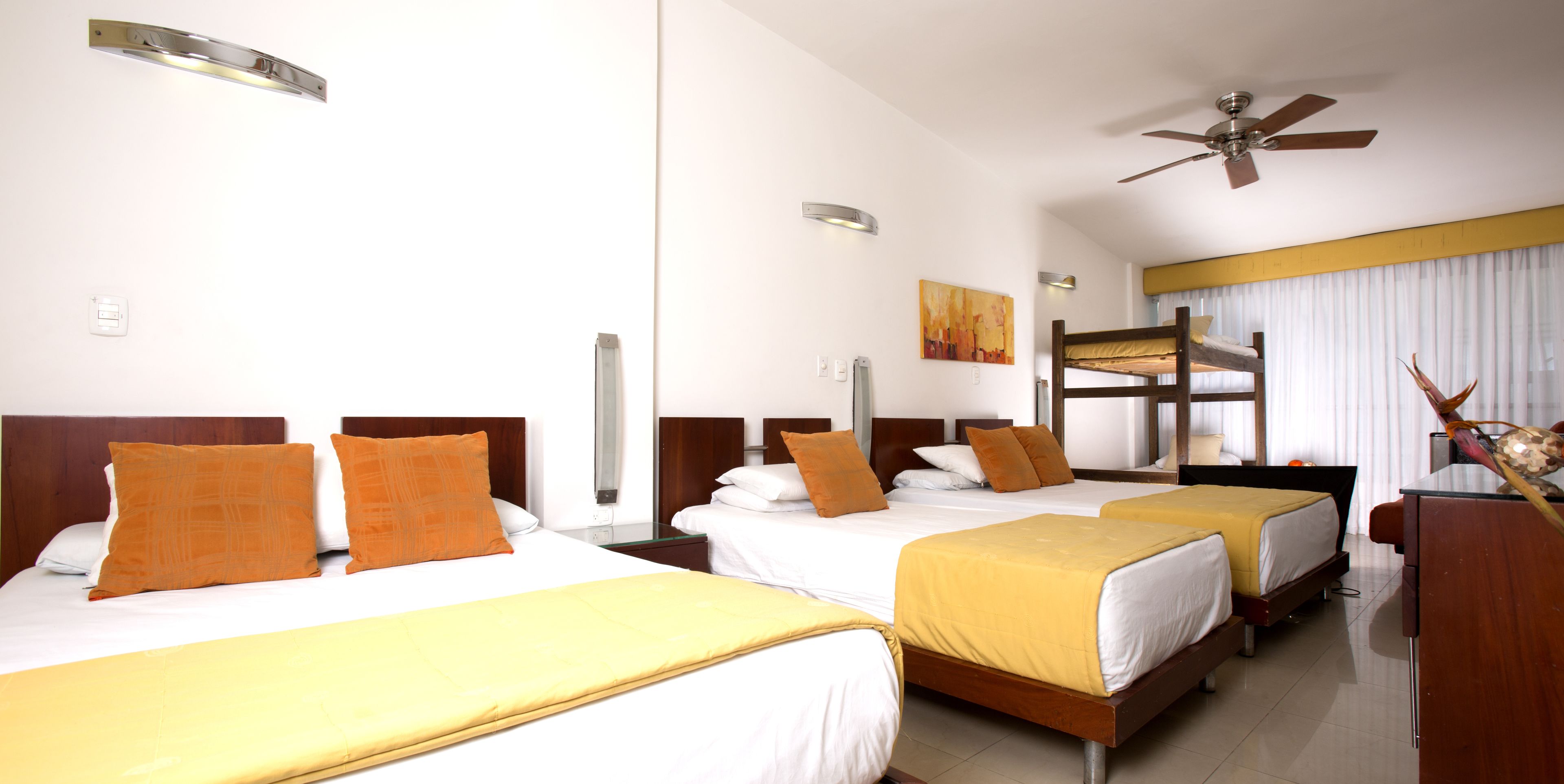 family room | minibar, in-room safe, desk, blackout curtains