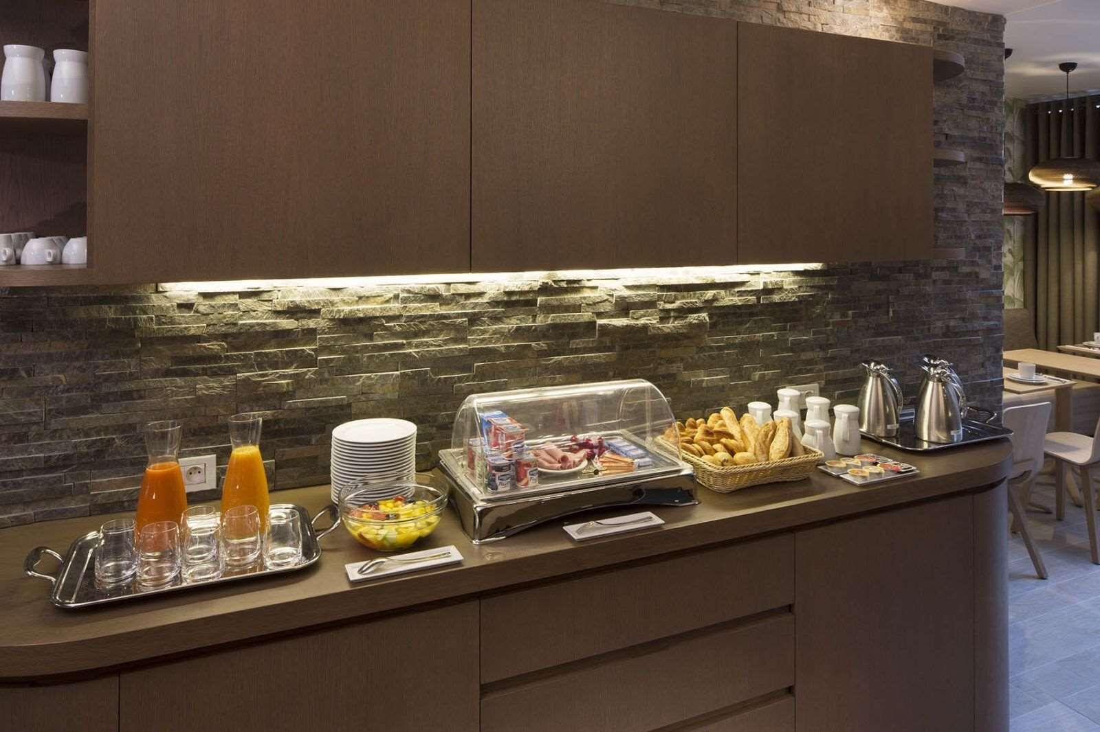 A breakfast buffet with various food items and beverages.