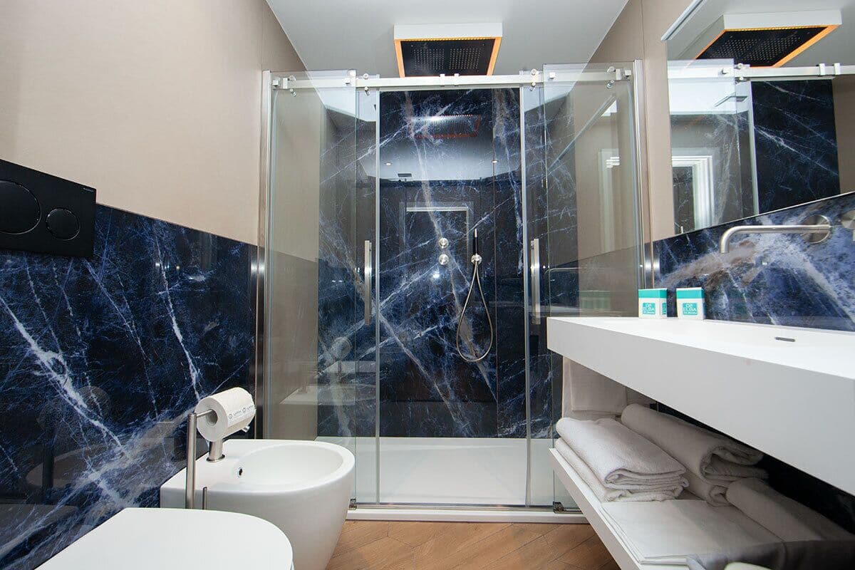 classic suite | bathroom | shower, rainfall showerhead, hair dryer, bidet