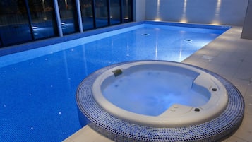 Indoor pool, open 8:00 AM to 8:00 PM, pool loungers