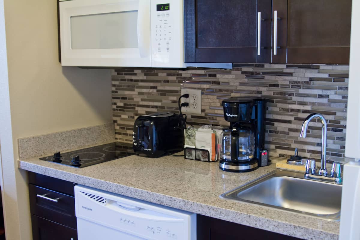 full-sized fridge, microwave, stovetop, dishwasher