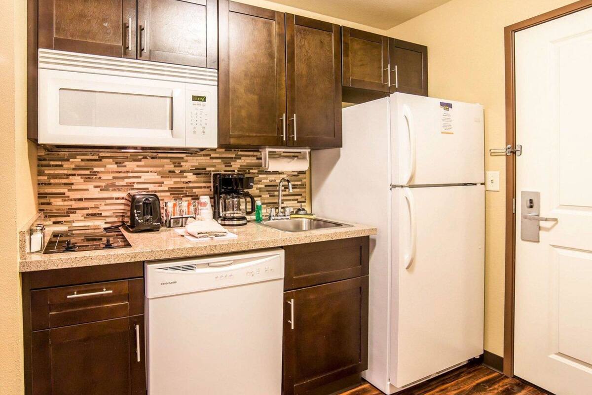 suite, 1 king bed with sofa bed, non smoking | desk, laptop workspace, blackout curtains, iron/ironing board