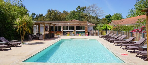 Seasonal outdoor pool, pool umbrellas, pool loungers