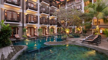Outdoor pool, open 9:00 AM to 9:00 PM, pool umbrellas, pool loungers