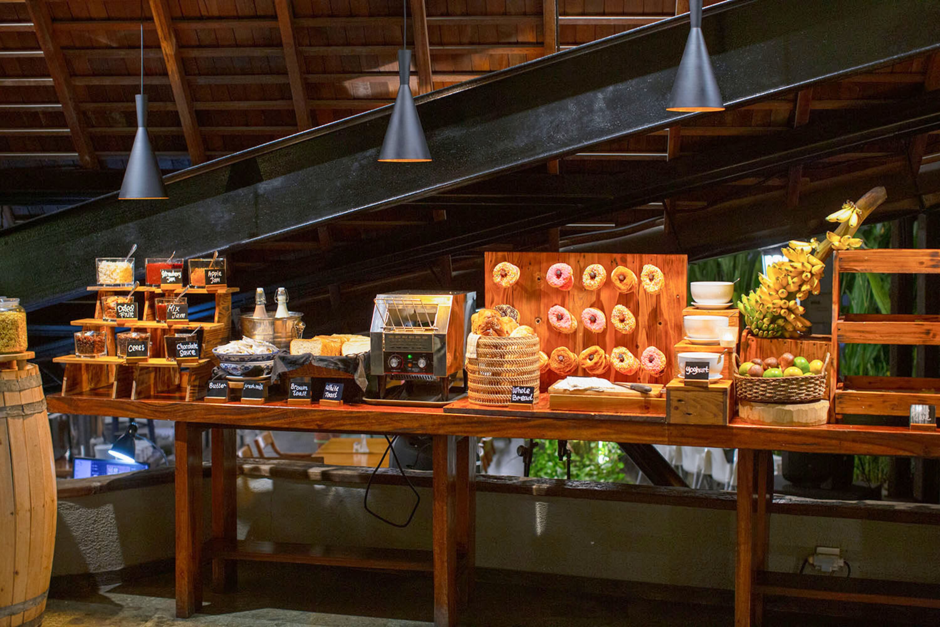 A bakery display with various baked goods and a coffee machine.