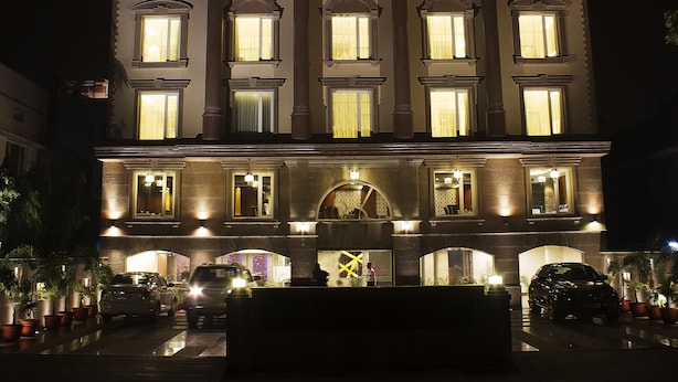 A multi-story building with illuminated signage reading "REGENT GRAND". - Hotel Regent Grand (New Delhi)