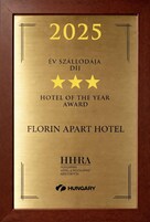 A plaque with the year 2025, indicating a Hotel of the Year Award for Florin Apart Hotel.