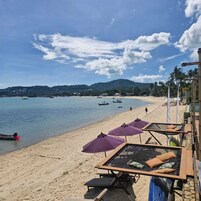 On the beach, sun loungers, beach umbrellas, beach towels
