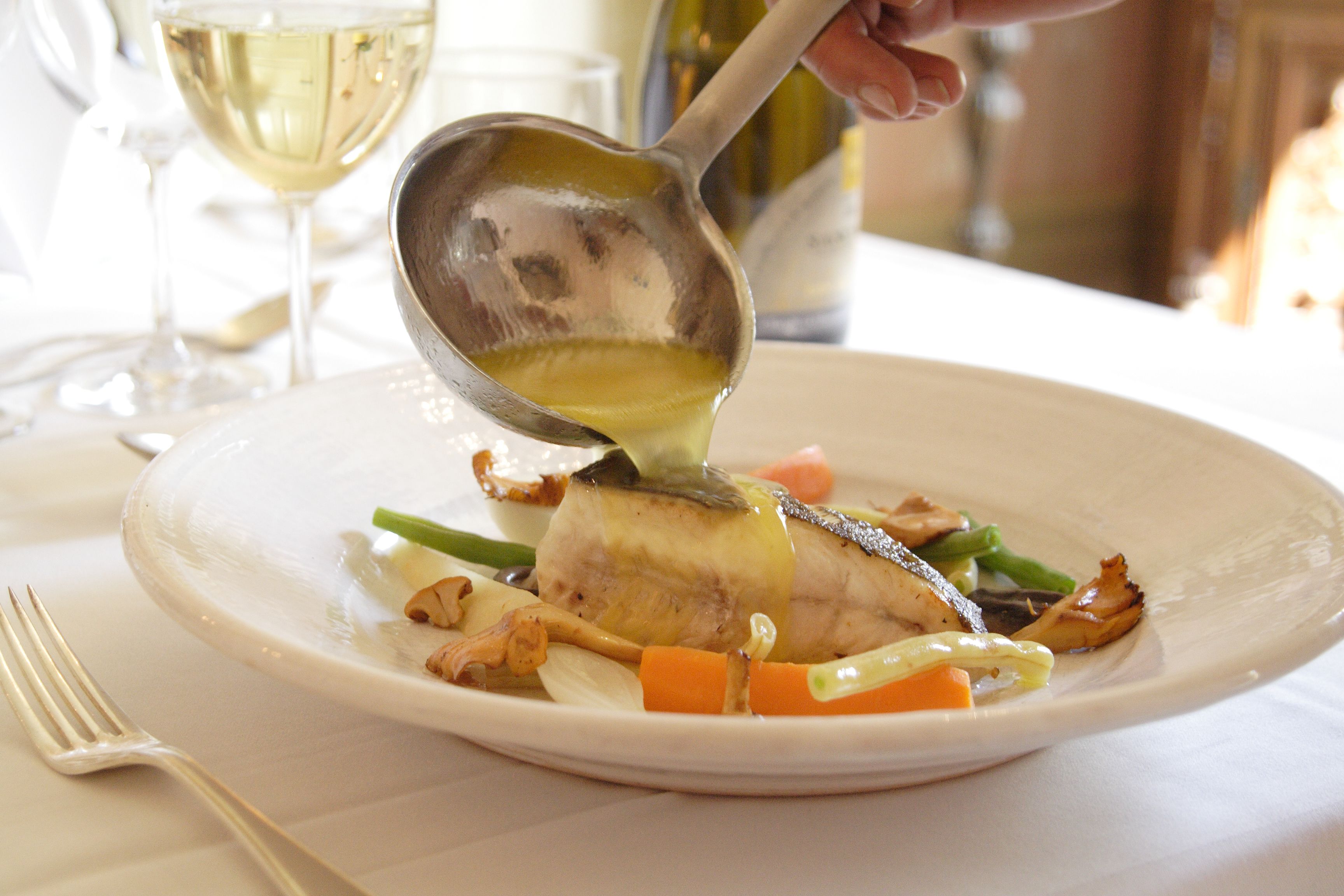 A plate of food with a fork on the side.
