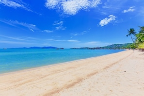 On the beach, white sand, sun loungers