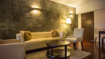 Grand Suite, 1 Bedroom | Living room | 32-inch LCD TV with cable channels, TV