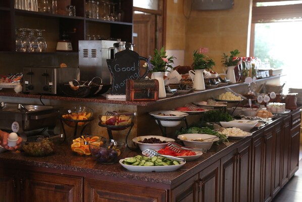 A buffet with various food items and a sign that reads "Good Morning". - Royal Stone Houses - Goreme (Nevsehir)