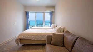 Standard Twin Room | Living area | 40-inch flat-screen TV with digital channels, TV, DVD player - Beachside Condominium (Chatan)