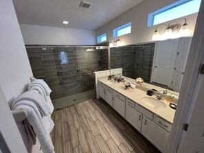 Bathtub, hair dryer, towels, soap
