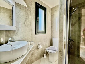 Bathtub, hair dryer, towels