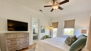 A bedroom with a bed, a dresser, a TV, and a ceiling fan. - 600ft from Beach Ocean view Heated Pool 4BR 4ba sleep11. 44 Summer Place 30A (Santa Rosa Beach)