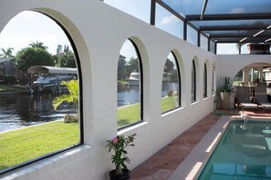 Outdoor pool, a heated pool - Waterfront luxury 4 bed 4 bath with large heated pool & dock (Cape Coral)