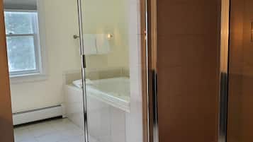 Shower, jetted tub, hair dryer, towels