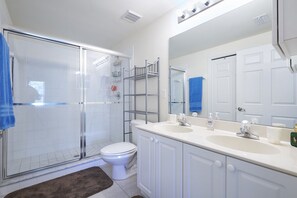 Bathtub, hair dryer, towels, soap
