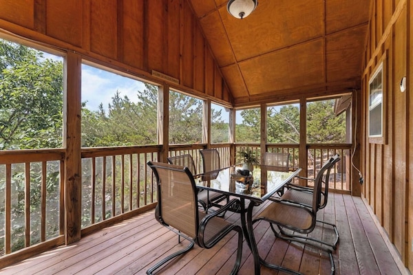 Beautiful screened-in porch to enjoy to enjoy the outdoors without the bugs! Lots of trees create privacy and a background of nature