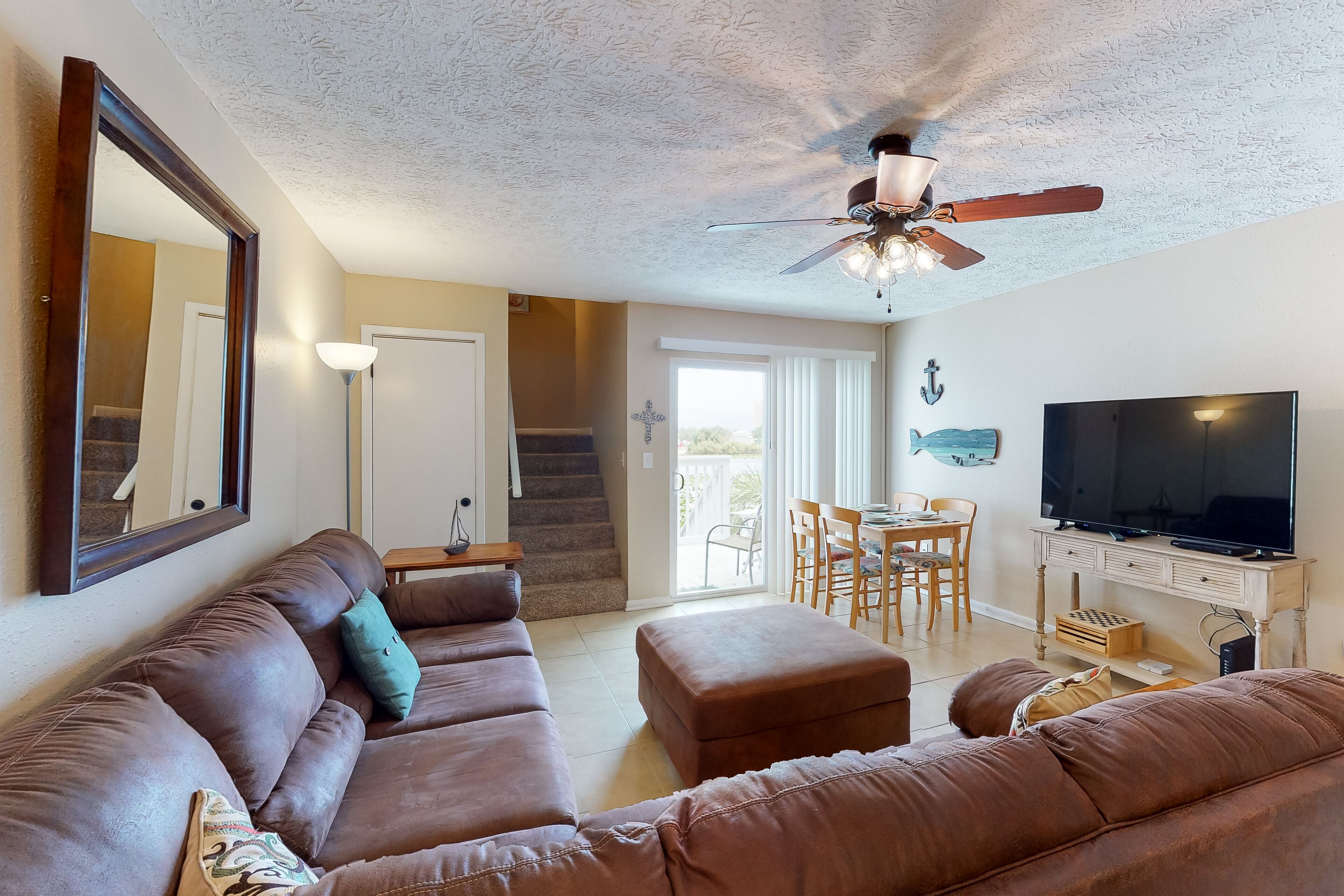 Two-story oasis near the beach w/ shared pool, patio, & ideal location!