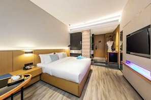 A hotel room with a bed, bedside table, TV, and a bathroom visible in the background. - Sofis Pop Hotel (Fuzhou)