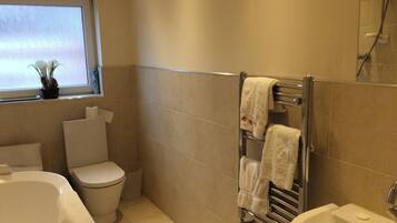 Combined shower/bathtub, deep-soaking bathtub, hair dryer, towels