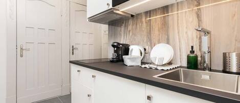 Fridge, microwave, stovetop, coffee/tea maker