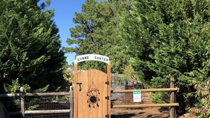 A wooden gate with a sign reading "WELCOME GUEST PARKING" and a sun emblem. - Located in # 6 golf community, close to First Health Moore Regional Hospital.  (Pinehurst)