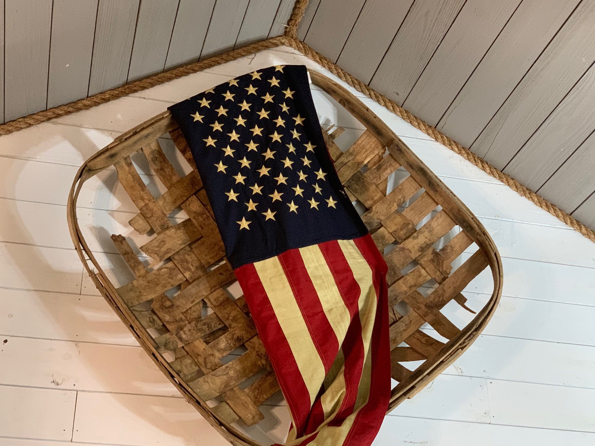 A wooden basket with a flag inside.