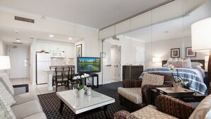 A hotel room with a dining area, a TV, a bed, and a sofa. - Longboat Key Club!! Direct Beachfront!! (Longboat Key)