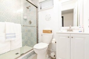 Shower, hair dryer, towels, soap