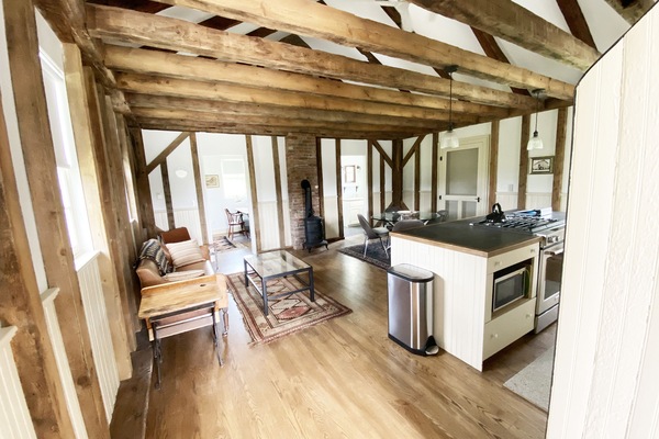 Upon entering the School House, large open space with kitchen to the right