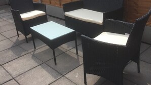 A patio area with a table and two chairs. - One Bedroom Maisonette with Terrace, Kidderminster (Kidderminster)
