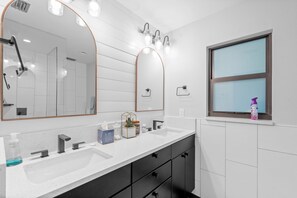 Combined shower/tub, hair dryer, towels, soap