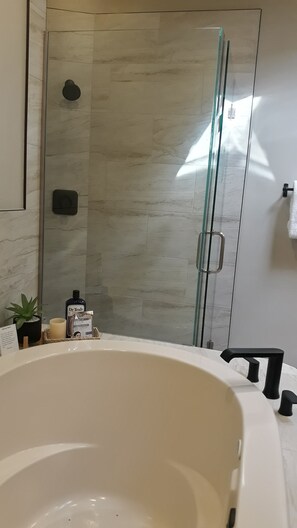 Bathtub, hair dryer, towels, soap