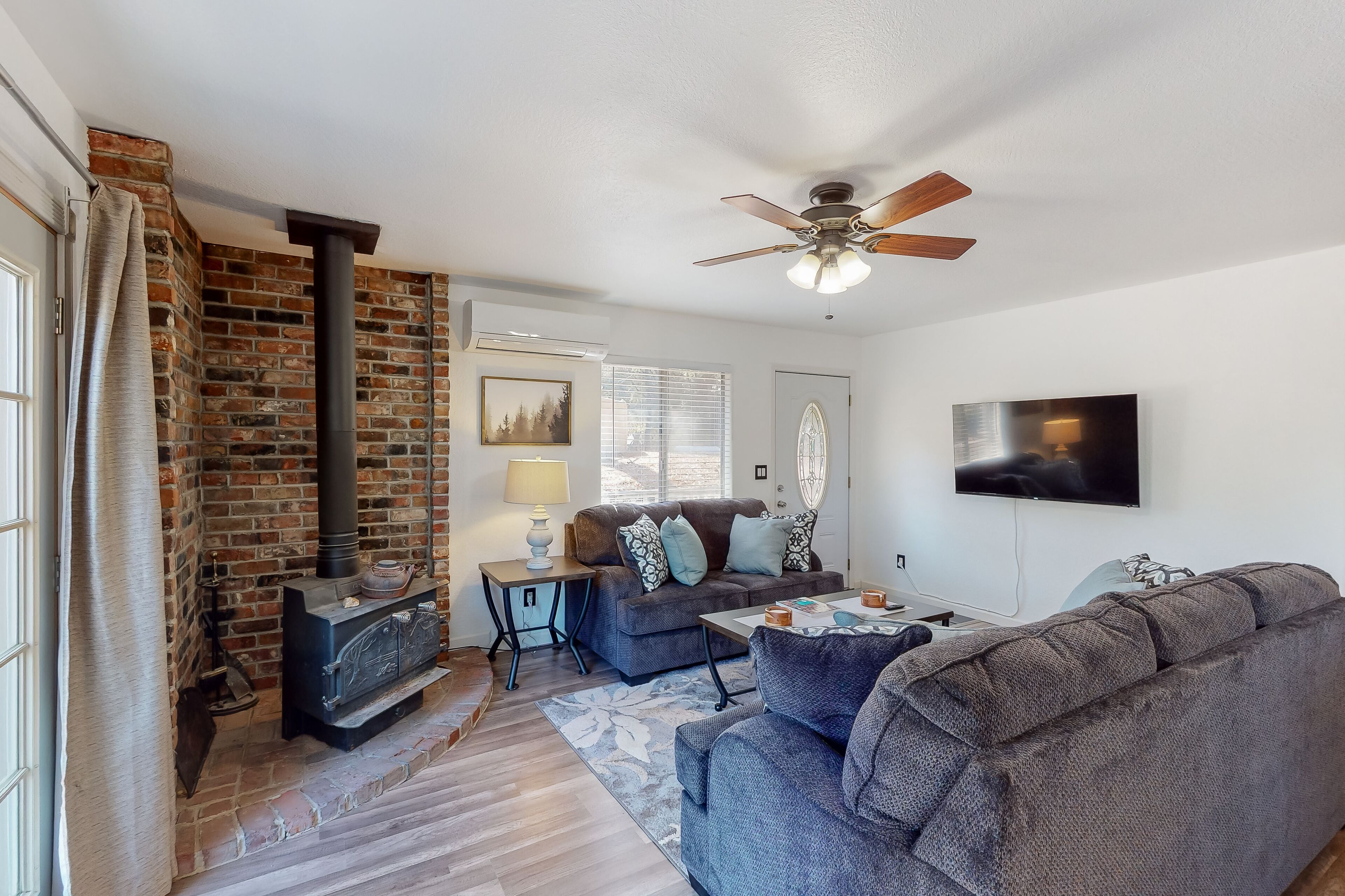 Lovely home away w/ wraparound deck, gas grill, full kitchen, & stylish decor!