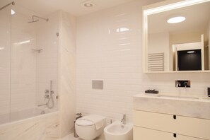 Bathtub, hair dryer, towels