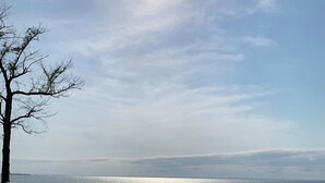 A swimming pool with a view of the sea and a white fence. - Waterfront Paradise on the Eastern Shore of Chesapeake Bay  (Rock Hall)