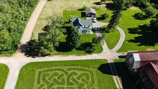 An aerial view of a property with a large field, a house, and a barn. - 1880 Farmhouse With Direct Access to Tall Pines ATV Park (Andover)