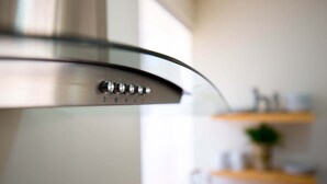 A kitchen hood with control knobs. - Quaint cozy studio located in the heart of El Paso  (El Paso)